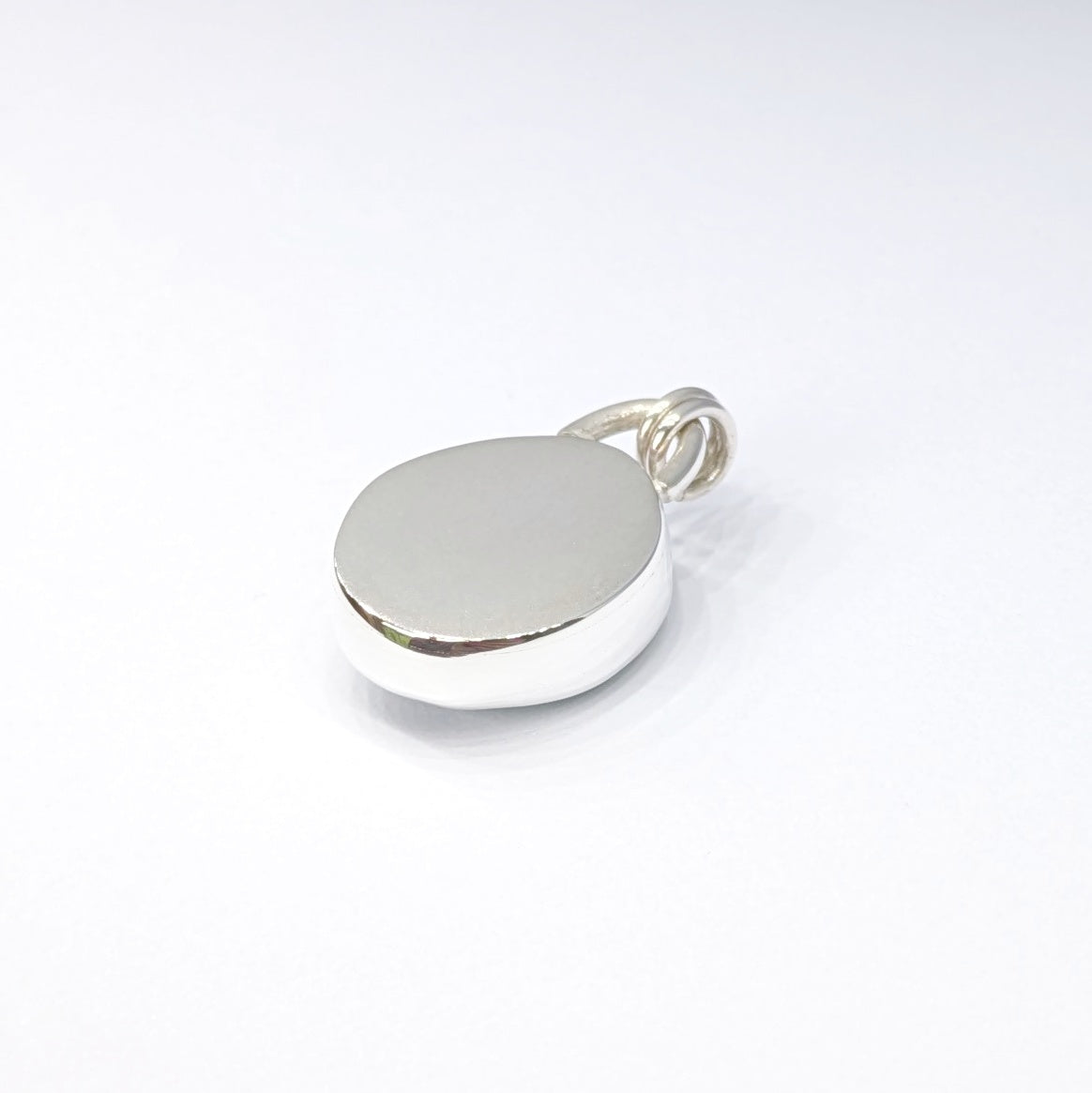 Back of Seafoam sea glass silver pendant with white background