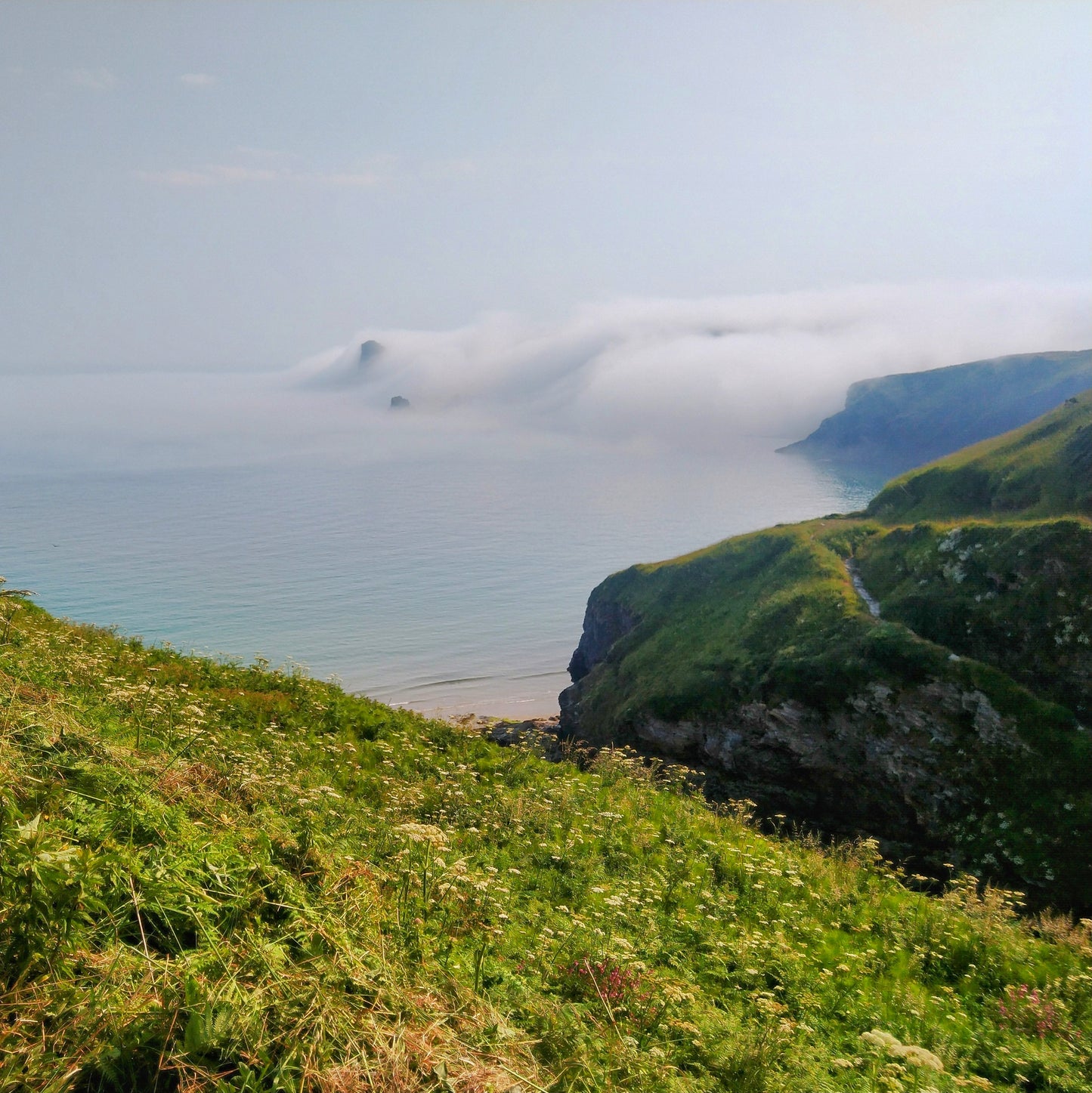 Rolling sea mist over Bossiney beach