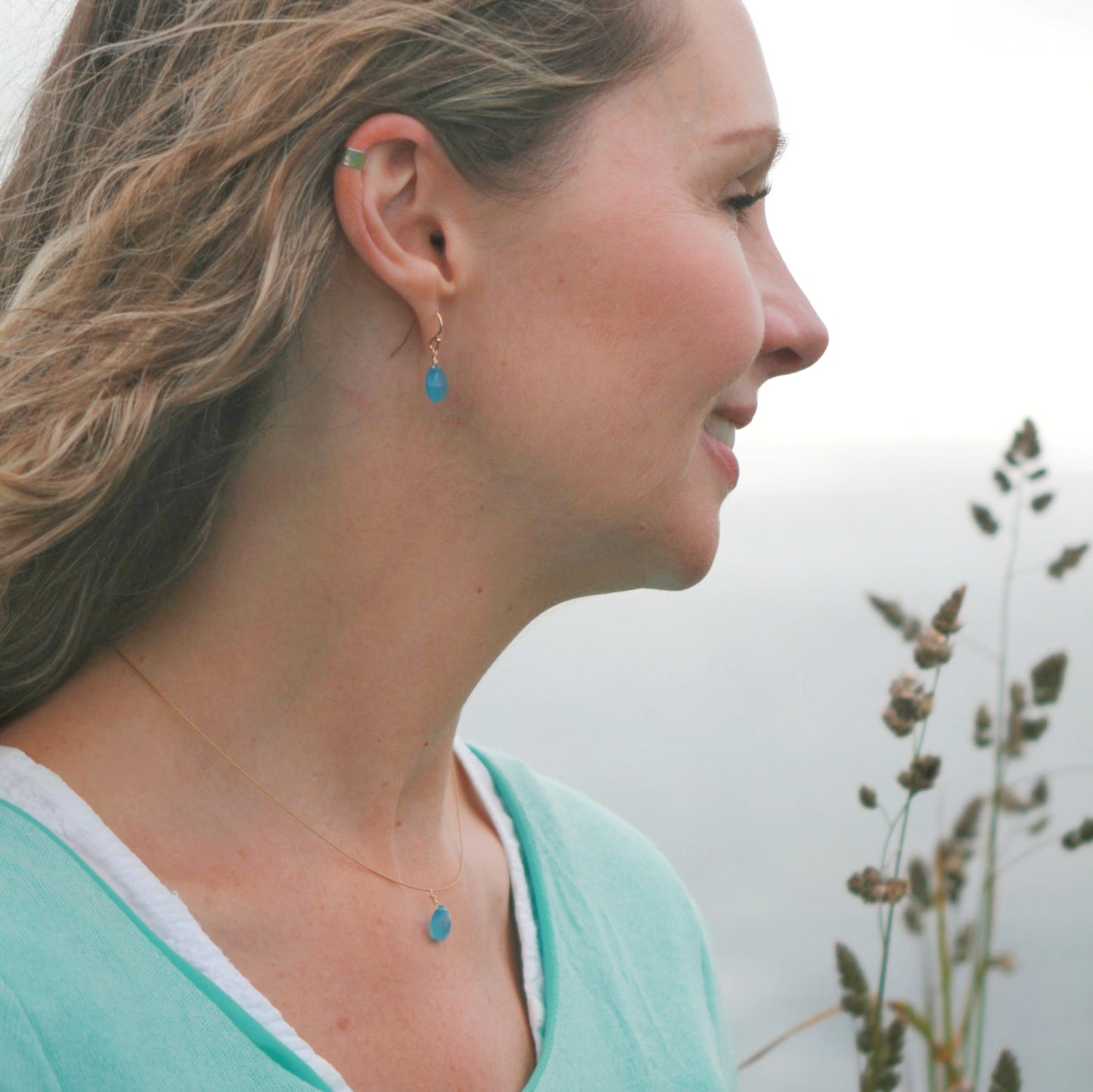 Model wearing Cornish Blue Sky Drop Earrings, Pendant and Silver Ear Cuff