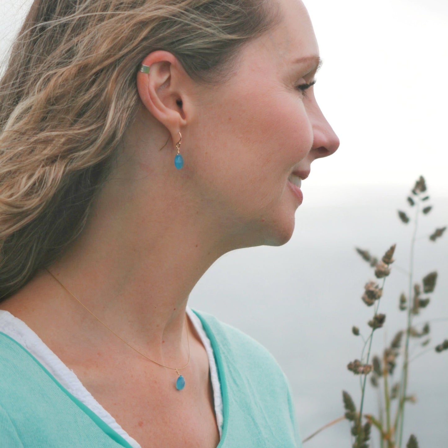 Model wearing Cornish Blue Sky Drop Pendant, Cornish Blue Sky Drop Earrings and Silver Ear Cuff