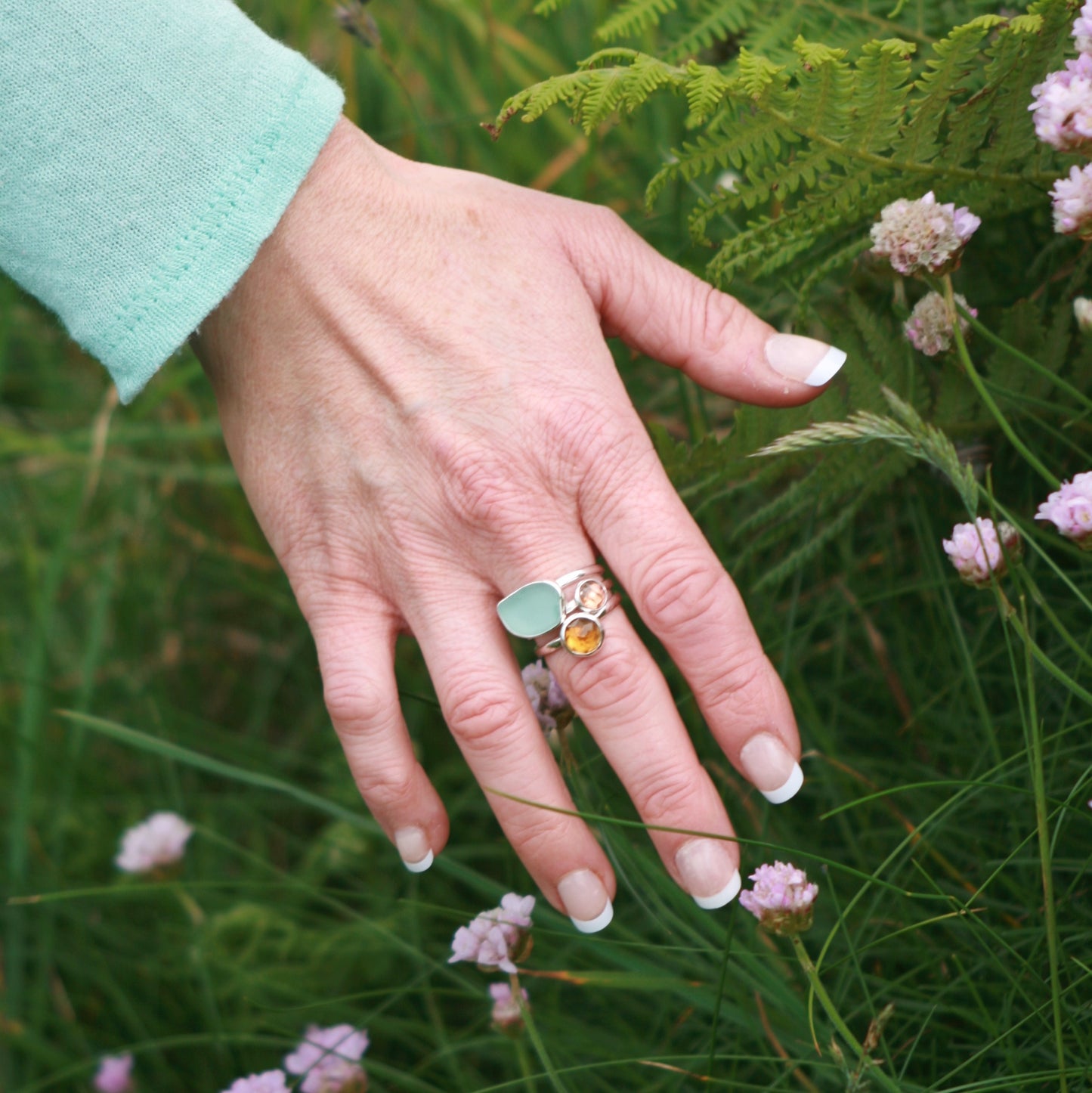 Model wearing Cornish Sunset Silver 3 Ring Stack