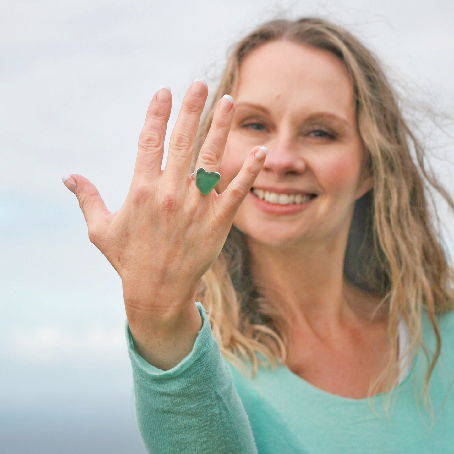 Silver and sea glass heart shaped ring. Heart of Green Sea Glass Ring on model