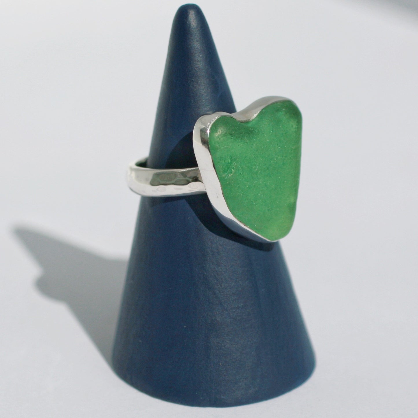 Heart of Green Sea Glass Ring on ring holder