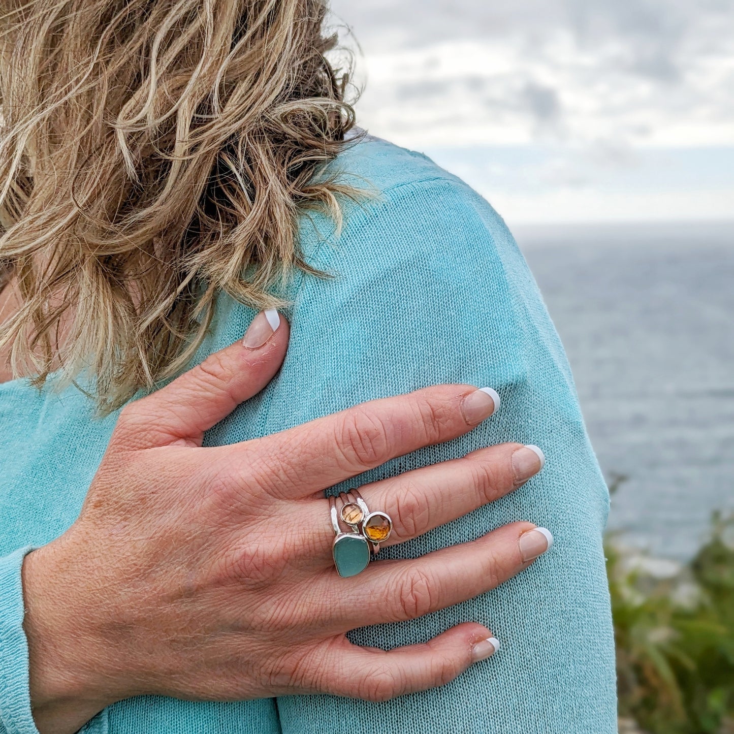 Model wearing Cornish Sunset Silver 3 Ring Stack