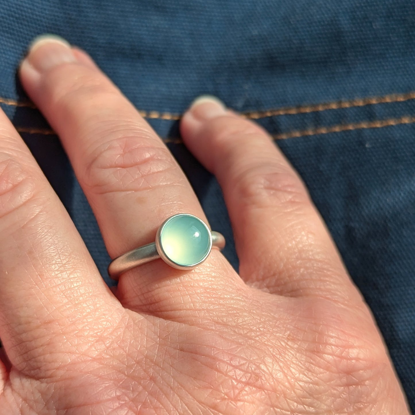 Silver and blue gemstone ring.
Dreamy Blue Chalcedony Silver Ring on hand