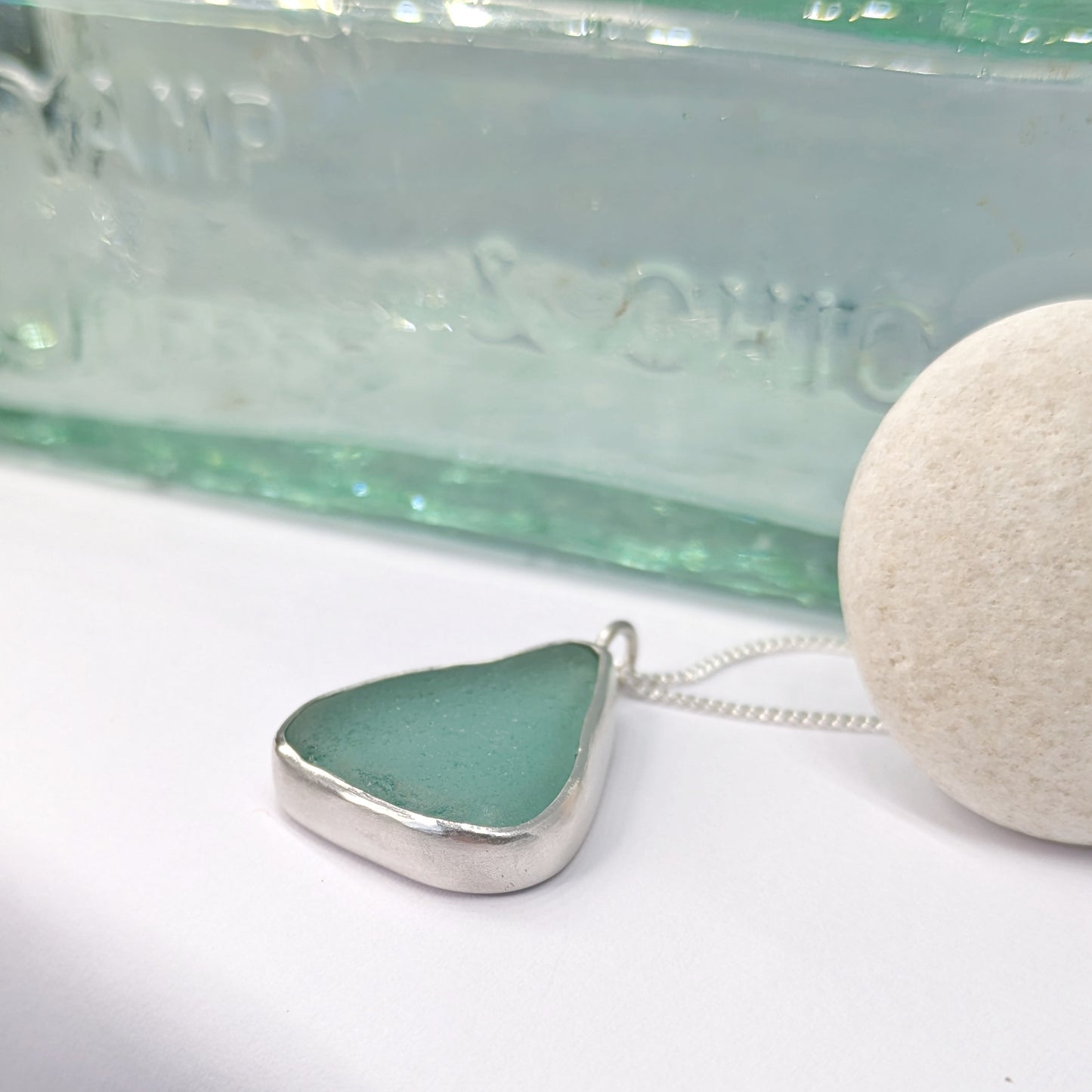 Teal Sea Glass Silver Pendant with old glass bottle & pebble