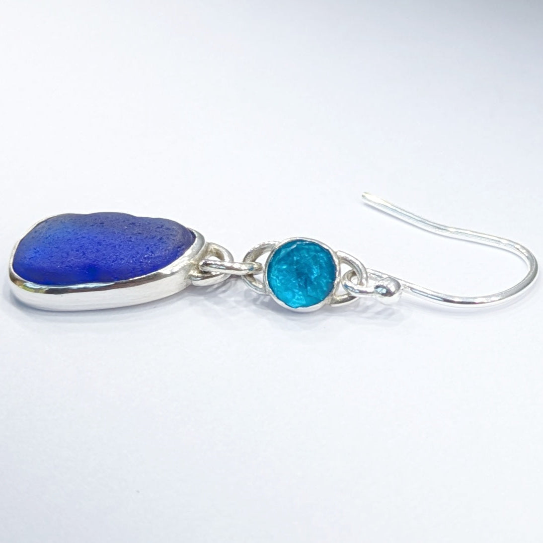 Singledanglyblueseaglassandgemstoneapatitesilverearringsshowingsideview