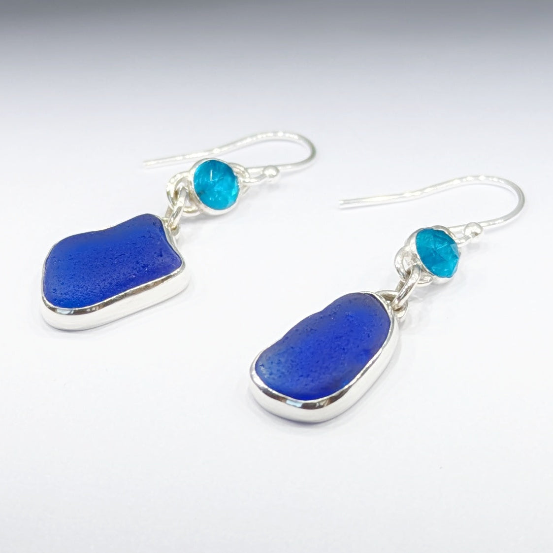 danglyblueseaglassandgemstoneapatitesilverearringsfacingleft