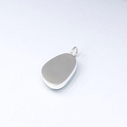 Back of Seafoam sea glass silver pendant with white background