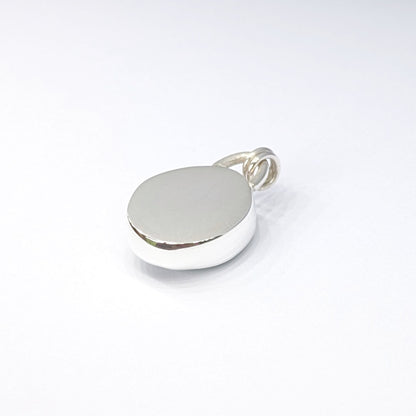 Back of Seafoam sea glass silver pendant with white background
