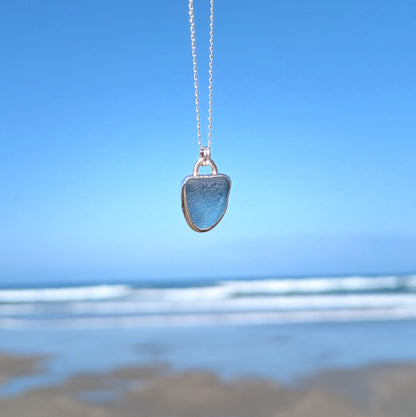 Cornish blue sea glass silver pendant looking out to sea