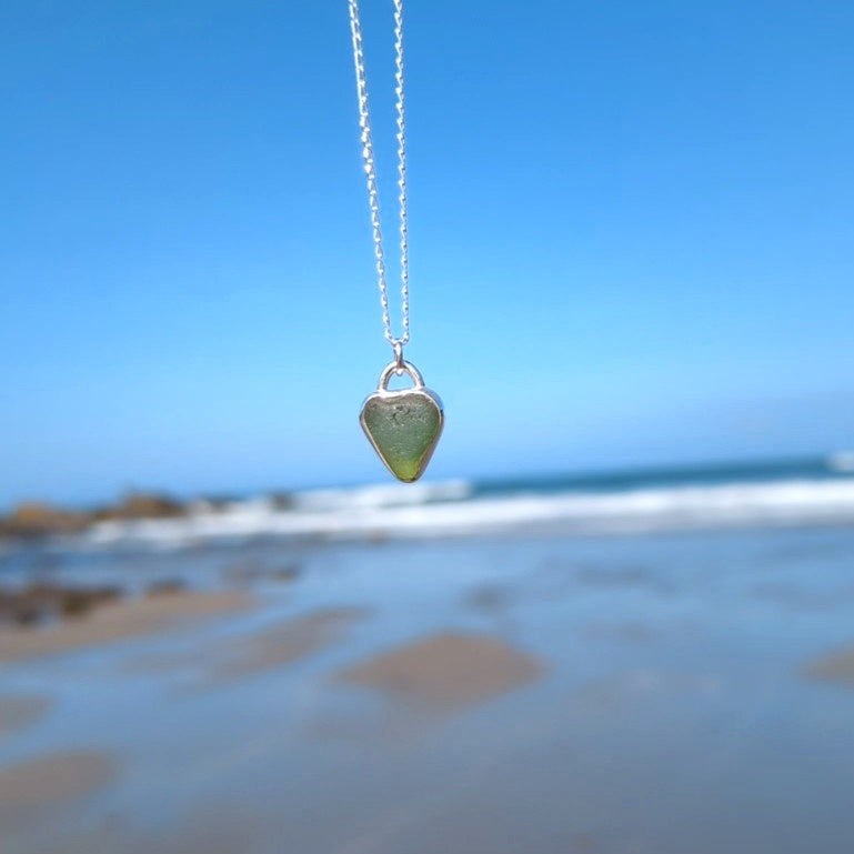 Front of St Ives heart shaped sea glass silver pendant looking out to sea
