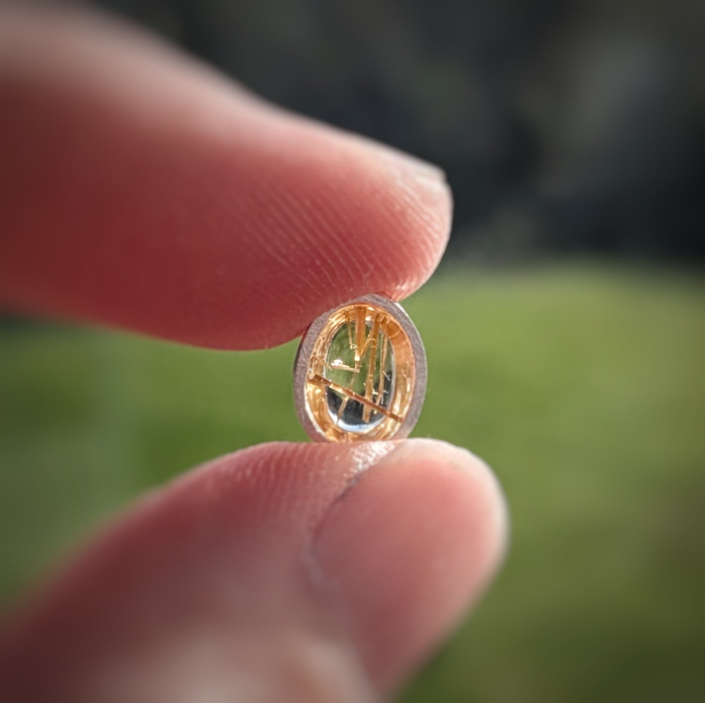 Golden Sparkle Quartz held up to the light