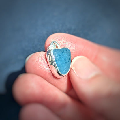 Cornish Blue Sea Glass Silver Pendant in hand