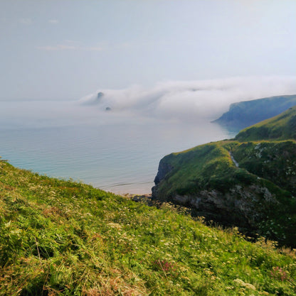 Rolling sea mist over Bossiney beach
