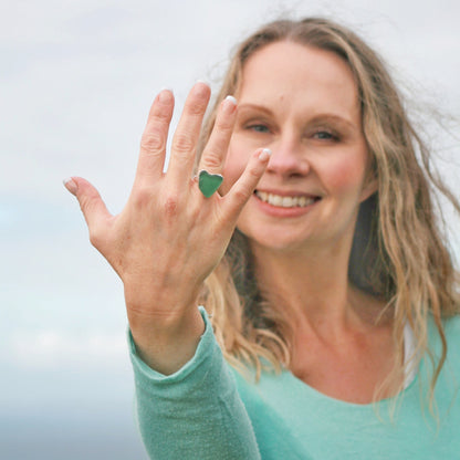 Silver and sea glass heart shaped ring.  Heart of Green Sea Glass Ring on model