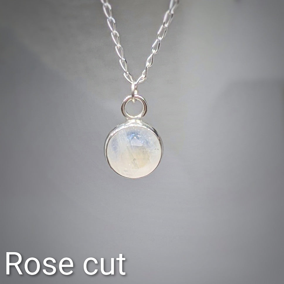 Close up Rose cut Snowball Moonstone pendant set in sterling silver on silver chain