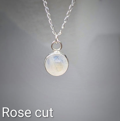 Close up Rose cut Snowball Moonstone pendant set in sterling silver on silver chain