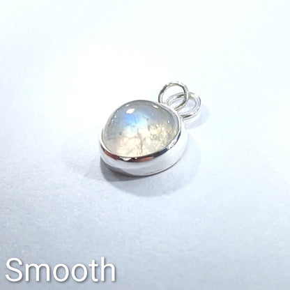 Full view of smooth cut Snowball Moonstone pendant set in sterling silver