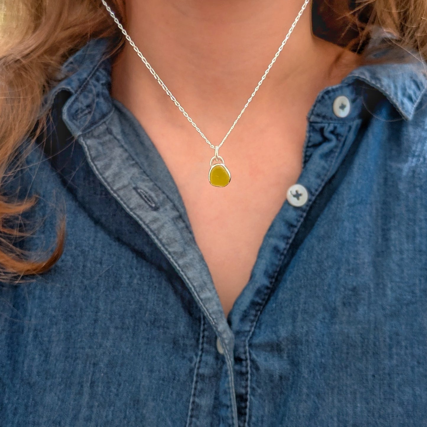 Model wearing Rare yellow sea glass silver pendant