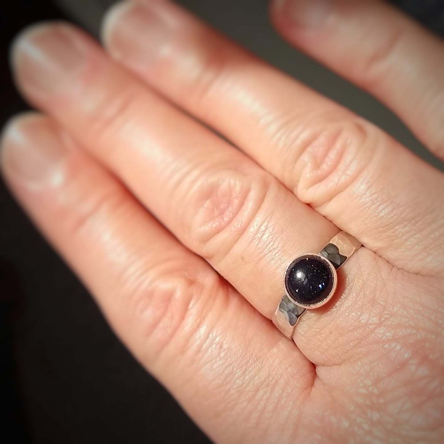 Blue Goldstone Silver Hammered Ring worn on hand