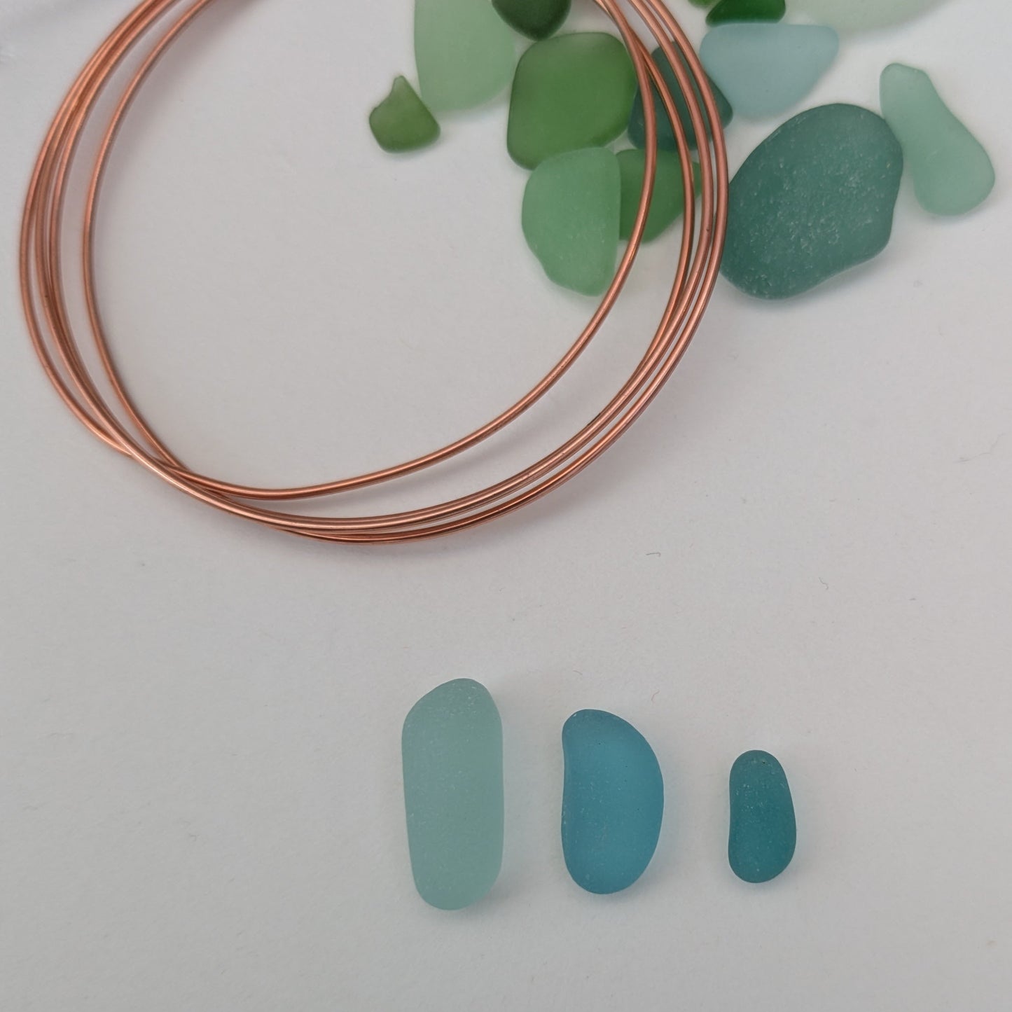 Beautiful blues - Handpicked sea glass 'beans' with copper wire