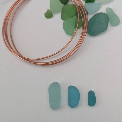 Beautiful blues - Handpicked sea glass 'beans' with copper wire