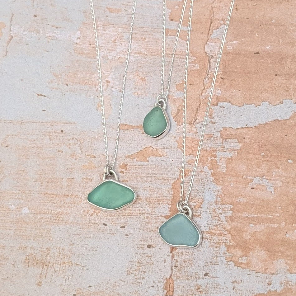 Three ocean coloured sea glass silver pendant necklaces