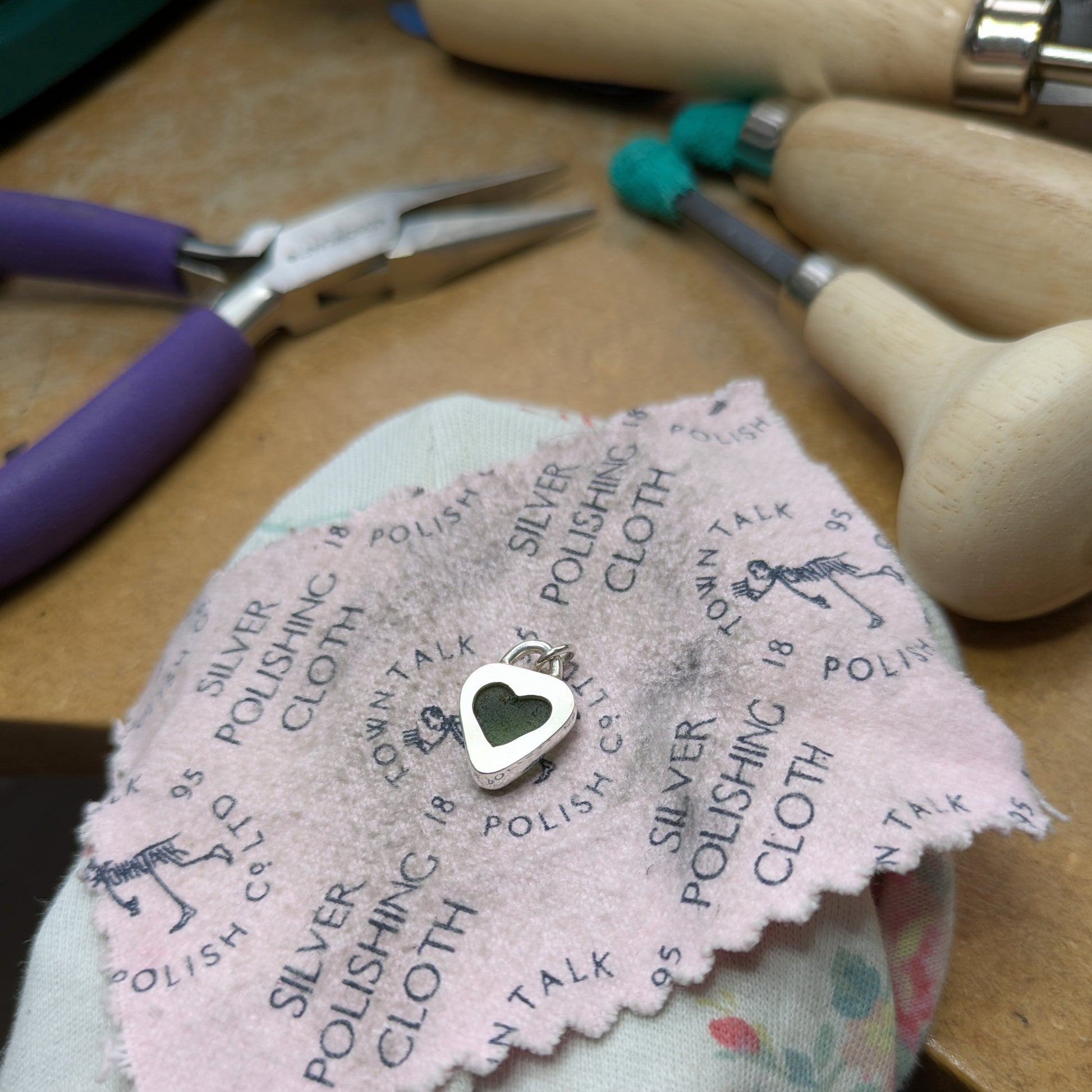View of back of St Ives Heart Shaped Sea Glass Silver Pendant with heart shaped cut out in back