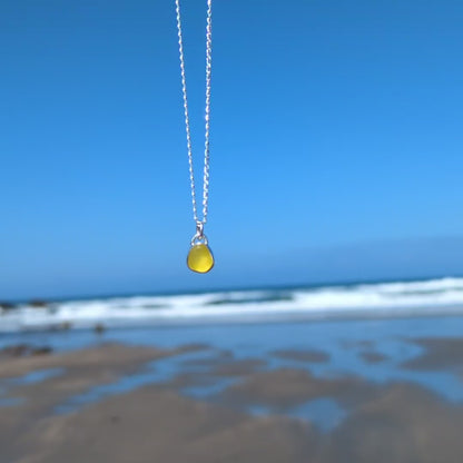 Video of rare yellow sea glass silver pendant looking out to sea