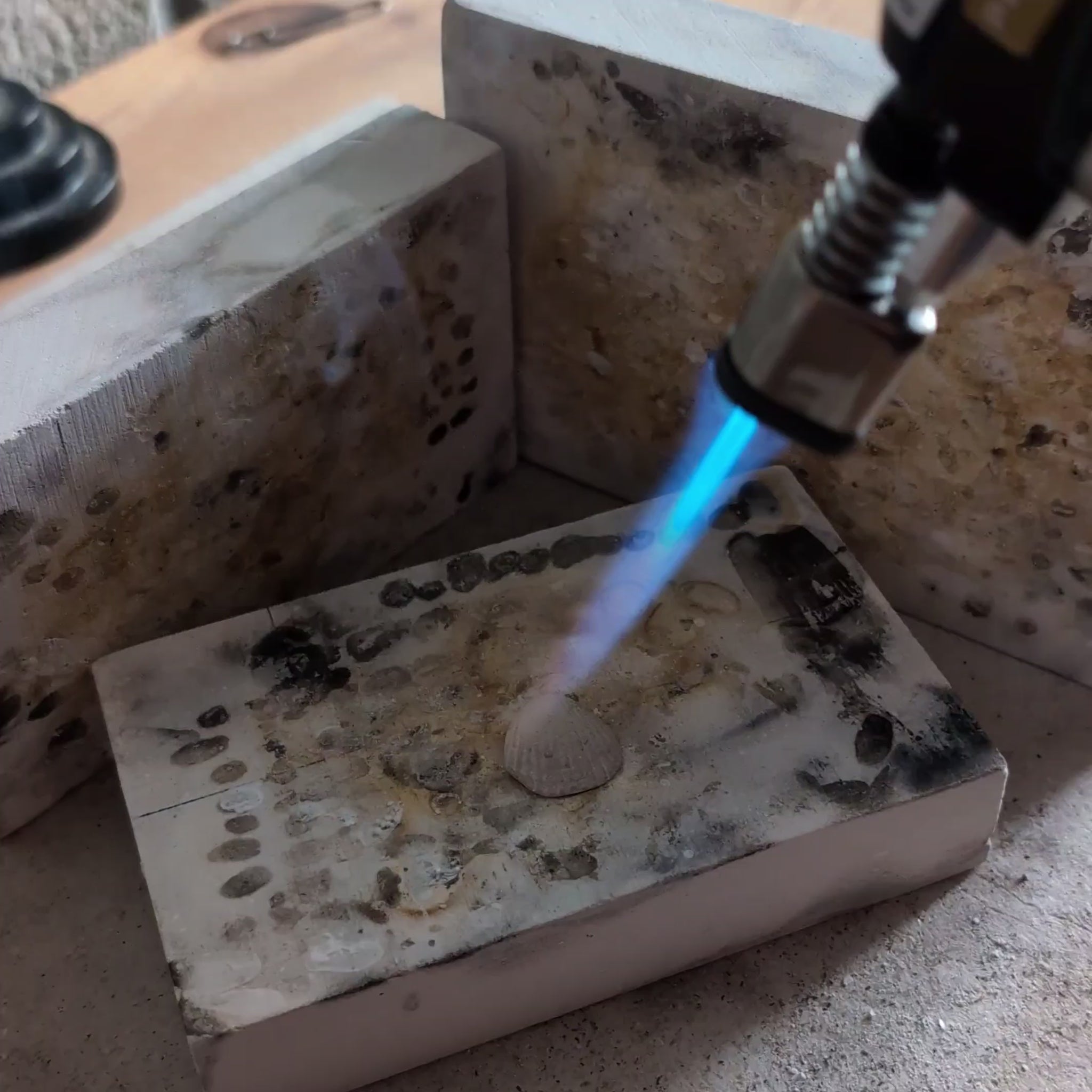 Video of blow torching Art silver clay sea shell, burning off the organic matter