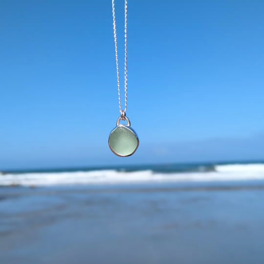 Video of chunky seafoam sea glass silver pendant looking out to sea