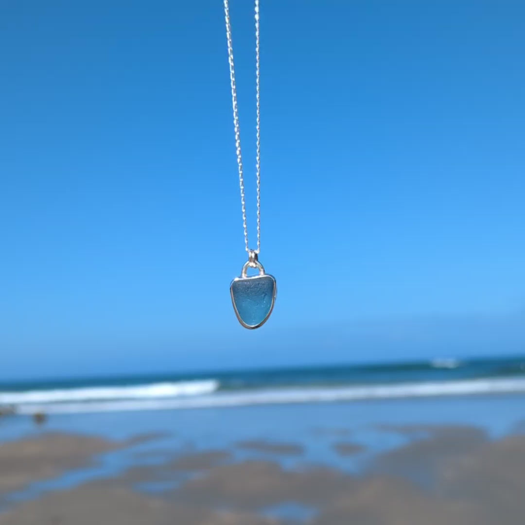 Video of Cornish blue sea glass silver pendant looking out to sea