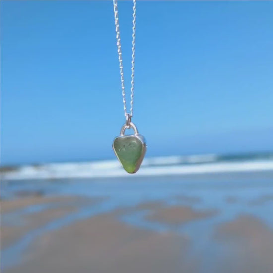 Front and back video of St Ives heart shaped sea glass silver pendant looking out to sea.