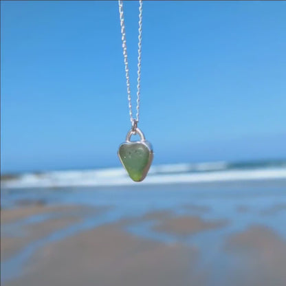 Front and back video of St Ives heart shaped sea glass silver pendant looking out to sea.