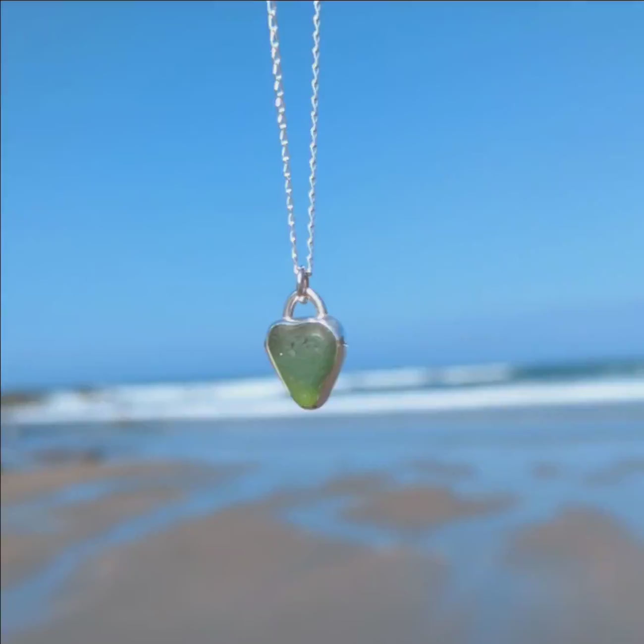 Front and back video of St Ives heart shaped sea glass silver pendant looking out to sea.