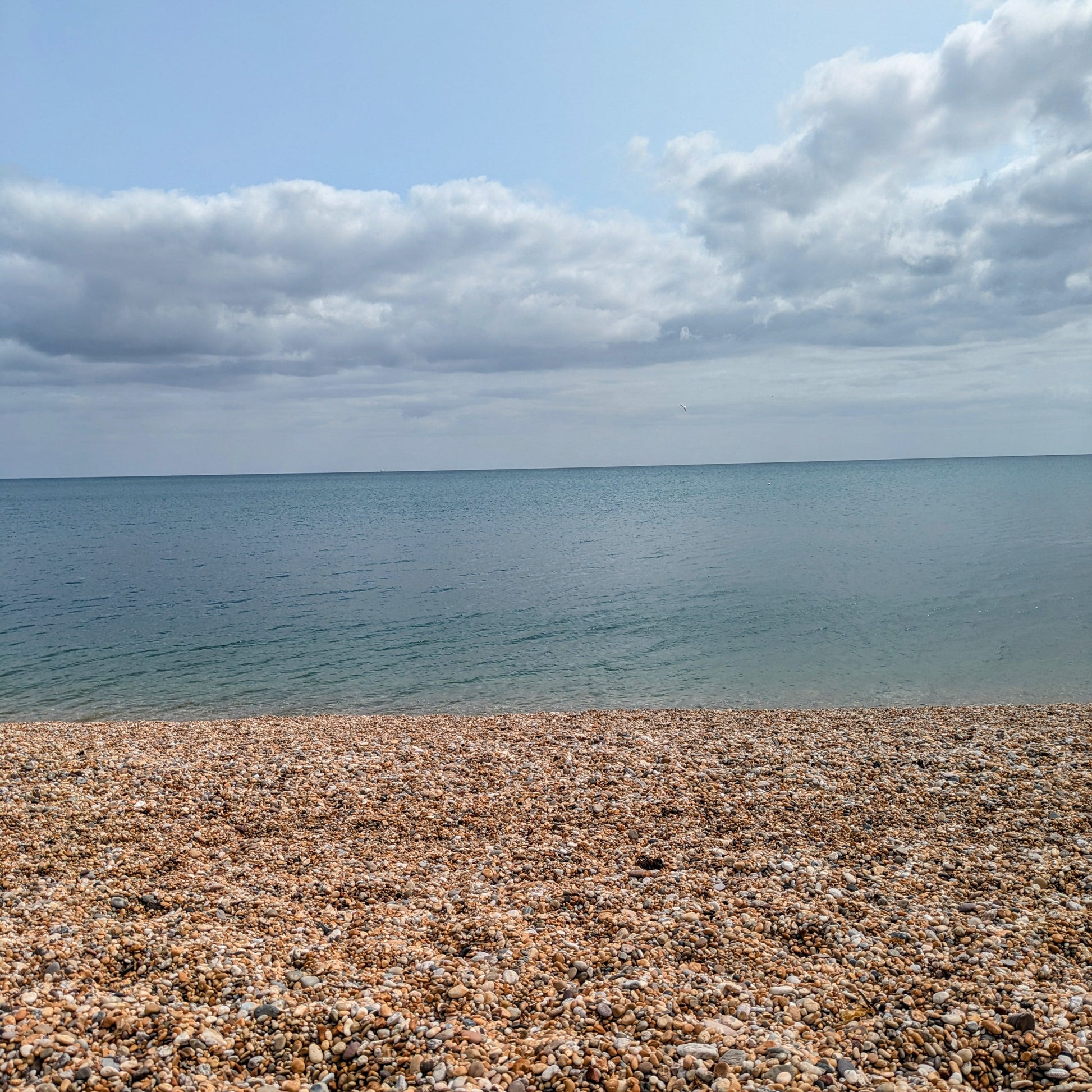 Tiny pebbles beach and sea
